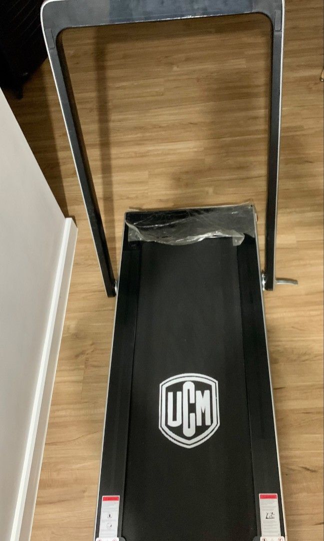 UCM Lifestyle Compact Treadmill (Category: Cardio & Fitness Machines) located in Quezon City. Submitted by chic.in.style (Listing ID 1469368373, Image 3). Description: - Brand/Model: UCM Lifestyle Compact Treadmill - Motor Power: 0.75 HP - Speed: Up to 12 km/h - Max User Weight: 100 kg - Dimensions: 134cm x 69cm x 107cm - Space-saving foldable design with detachable handlebar - Extras: Bluetooth connectivity, built-in cellphone holder, and wirele