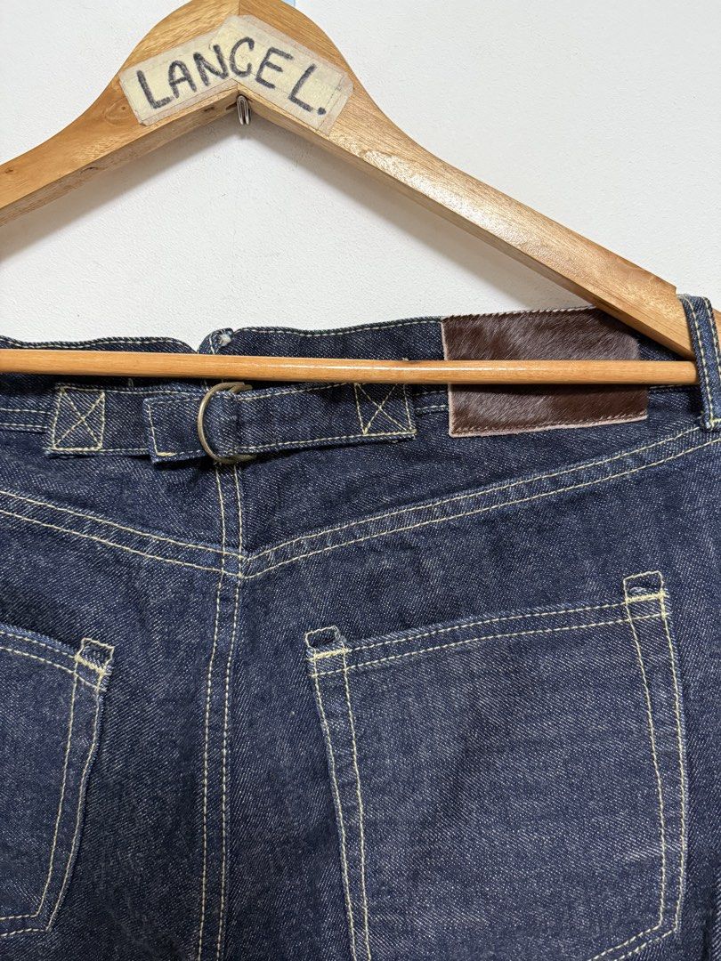 Uncle Fu Buckle Back Selvedge Jeans (Category: Jeans) located in Manila. Submitted by limsanity03 (Listing ID 1469299027, Image 3). Description: - Brand: Uncle Fu Maden Workwear - Style: Dark wash denim jeans with contrast stitching - Size: 33 (Model 175/82A) - Material: 100% cotton - Features: Back cinch buckle, calf hair style leather back patch, and custom graphic printed pocket lining - Condition: Unworn, properly stored Actual Dimes Waist 33