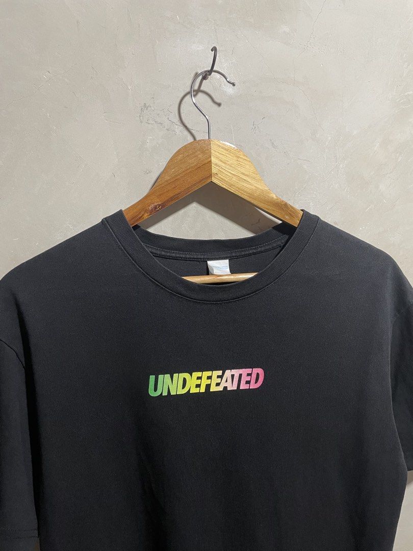 Undefeated Black T-Shirt with Gradient Logo (Category: Tshirts & Polo Shirts ) located in Zamboanga. Submitted by guthens (Listing ID 1469304723, Image 3). Description: Condition- excellent Issue- none Color rate- 9.5/10.