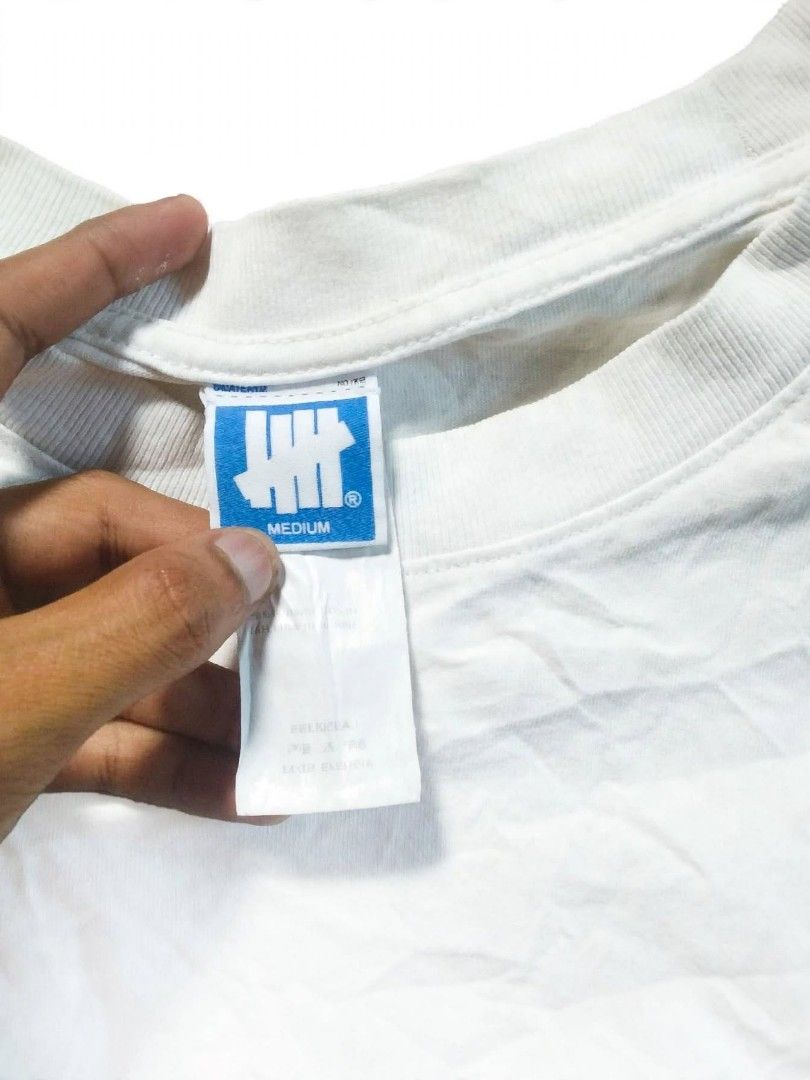 Undefeated Camo Logo White T-Shirt Medium (Category: Tshirts & Polo Shirts ) located in Digos. Submitted by echooo123 (Listing ID 1469236948, Image 2). Description: WTS: UNDFTD CAMOU WOODLAND ICON💎 Size: Large Dimes: 22x29 Good Condition No Issues Solid over all Need wash only Cr: 9.8/10 DM: 📥.