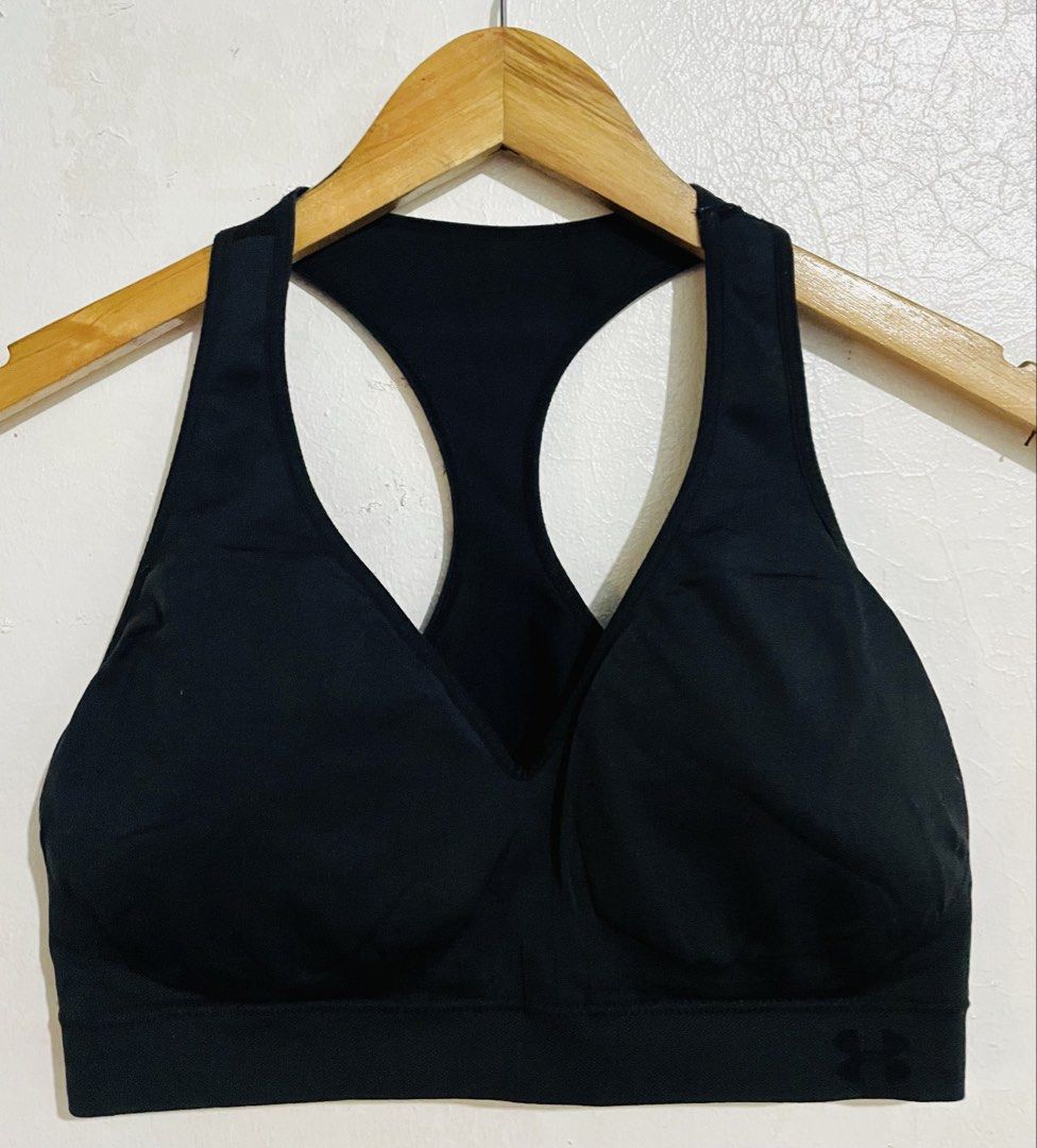 Under Armour Black Sports Bra (Category: Activewear) located in Caloocan City. Submitted by lovemyclothes21 (Listing ID 1469265381, Image 1). Description: - Brand: Under Armour - Color: Black - Design: Racerback with molded cups - Support: Wide elastic underband for a secure fit - Comfort: Breathable fabric to keep you cool - Details: Under Armour logo on lower front band - Condition: Great addition to your gym wardrobe.