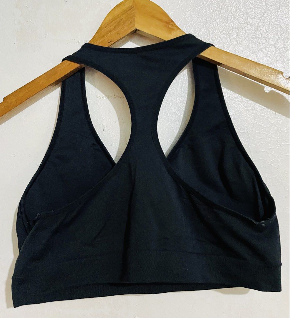 Under Armour Black Sports Bra (Category: Activewear) located in Caloocan City. Submitted by lovemyclothes21 (Listing ID 1469265381, Image 2). Description: - Brand: Under Armour - Color: Black - Design: Racerback with molded cups - Support: Wide elastic underband for a secure fit - Comfort: Breathable fabric to keep you cool - Details: Under Armour logo on lower front band - Condition: Great addition to your gym wardrobe.