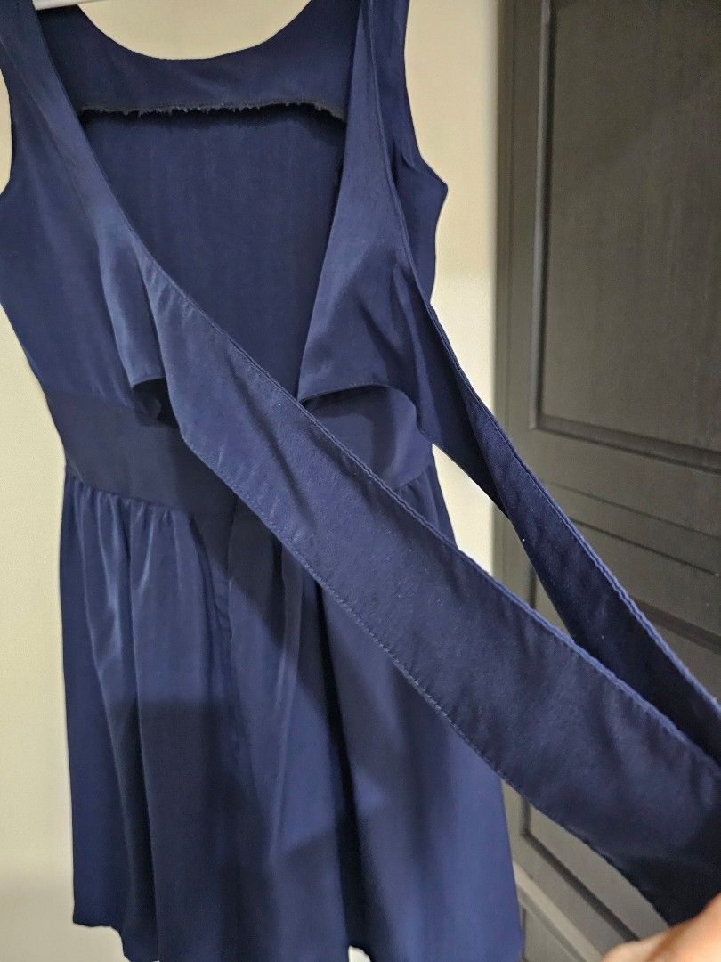 Unicode Navy Blue Flare Dress (Category: Dresses) located in Quezon City. Submitted by alevi (Listing ID 1469187155, Image 3). Description: - Brand: Unicode - Color: Navy blue - Style: Sleeveless dress with flared pleated skirt and open back strap design - Closure: Hidden back zipper - Material: Lightweight and comfortable - Condition: Clean inside and out, great for casual outings or dates.