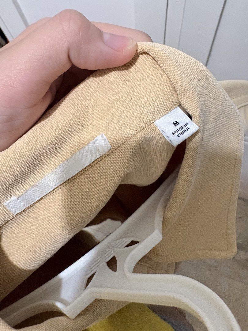 Uniqlo Beige Canvas Workwear Jacket Size M (Category: Coats, Jackets and Outerwear) located in Taguig. Submitted by kiiimmy_ (Listing ID 1469202082, Image 3). Description: - Brand/Model: Uniqlo Utility Jacket - Color: Versatile beige - Size: Medium (tag attached) - Material: Durable canvas fabric - Features: Button-up front, standard collar, button cuffs, two large patch pockets - Origin: Made in China - Condition/Style: Clean neutral color, grea