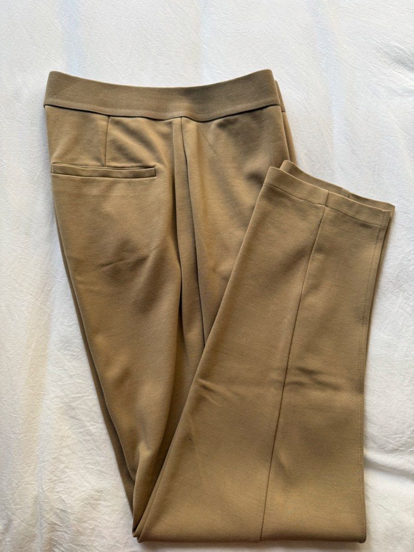 Uniqlo Pants Khaki Brown Size S (Category: Jeans) located in Manila. Submitted by the.prelovedcloset (Listing ID 1469255702, Image 3). Description: - Brand: Uniqlo - Color: Khaki brown - Size: S (fits waist 60-66cm) - Material: Rayon, nylon, and spandex blend for comfort and stretch - Features: Stretch waistband, chic front seam details, and a back pocket - Condition: Clean, well-maintained, and in great shape.