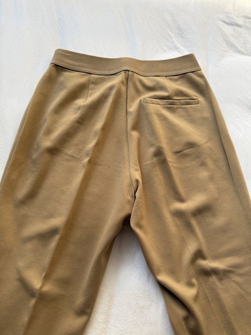 Uniqlo Pants Khaki Brown Size S (Category: Jeans) located in Manila. Submitted by the.prelovedcloset (Listing ID 1469255702, Image 2). Description: - Brand: Uniqlo - Color: Khaki brown - Size: S (fits waist 60-66cm) - Material: Rayon, nylon, and spandex blend for comfort and stretch - Features: Stretch waistband, chic front seam details, and a back pocket - Condition: Clean, well-maintained, and in great shape.
