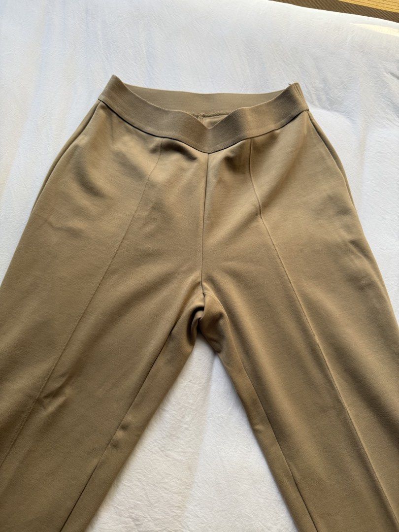 Uniqlo Pants Khaki Brown Size S (Category: Jeans) located in Manila. Submitted by the.prelovedcloset (Listing ID 1469255702, Image 1). Description: - Brand: Uniqlo - Color: Khaki brown - Size: S (fits waist 60-66cm) - Material: Rayon, nylon, and spandex blend for comfort and stretch - Features: Stretch waistband, chic front seam details, and a back pocket - Condition: Clean, well-maintained, and in great shape.