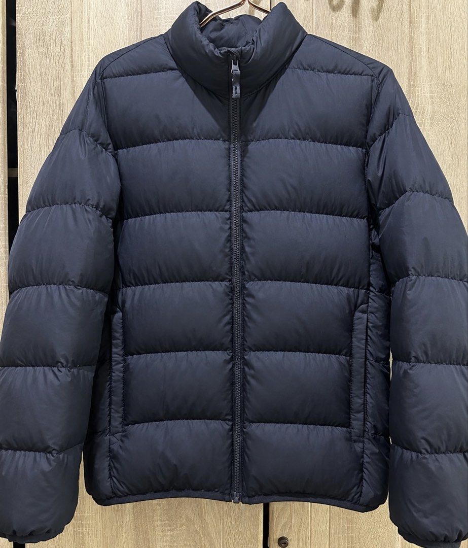 UNIQLO Ultra Light Down / Puffer Jacket (Category: Coats, Jackets and Outerwear) located in Manila. Submitted by manifestd (Listing ID 1469255667, Image 1). Description: UNIQLO Ultra Light Down / Puffer Jacket ✔️Dark blue (almost black) ✔️Medium on tag but fits large with room to layer 23” width, 26-27” length ✔️Ultra lightweight but strong insulation ✔️Packable, with zippered pockets ✔️Horizontal baffling that helps evenly distribute the insulat
