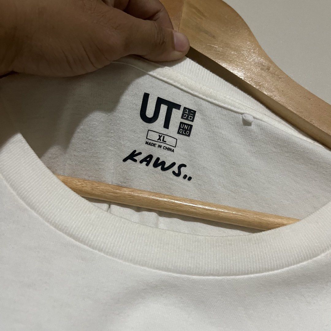 Uniqlo x KAWS Flayed White Tee Size XL (Category: Tshirts & Polo Shirts ) located in Argao. Submitted by secondcyclecollection (Listing ID 1469295652, Image 3). Description: - Brand: Uniqlo UT x KAWS - Design: Iconic Flayed Companion graphic on front with embroidered XX logo on the right sleeve - Color: White - Size: XL - Style: Standard crew neck, short sleeves - Condition: Clean overall, well-maintained - Origin: Made in China - Perfect for str