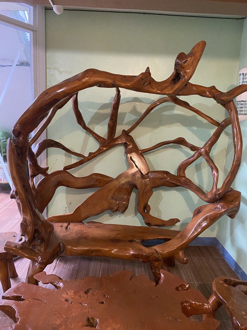 Unique Molave Wood Root Bench (Category: Chairs) located in Iloilo. Submitted by valysa (Listing ID 1469204682, Image 1). Description: - Handcrafted from natural tree roots and branches - Beautiful polished finish highlights unique wood grain and organic shapes - Features a sturdy seating area with an artistic canopy structure - Heavy, solid wood construction built to last - Ideal statement piece for rustic or eclectic indoor setups.