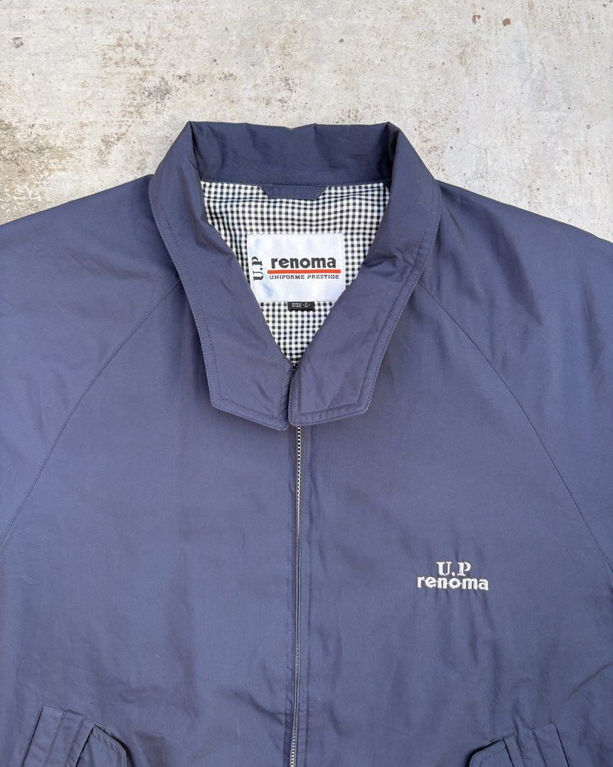 U.P Renoma Harrington Jacket (Category: Coats, Jackets and Outerwear) located in Calamba. Submitted by lyrons.wardrobe (Listing ID 1469255870, Image 3). Description: Dimes: 24⅜/25.5 • Brand/Line: U.P. Renoma (Uniforme Prestige) — a sub-line of the French fashion house Renoma, popular for casual and tailored outerwear. • Color: Navy blue with white and black gingham/checkered pattern lining. • Design Features: Full zip-up front, stand collar, embr