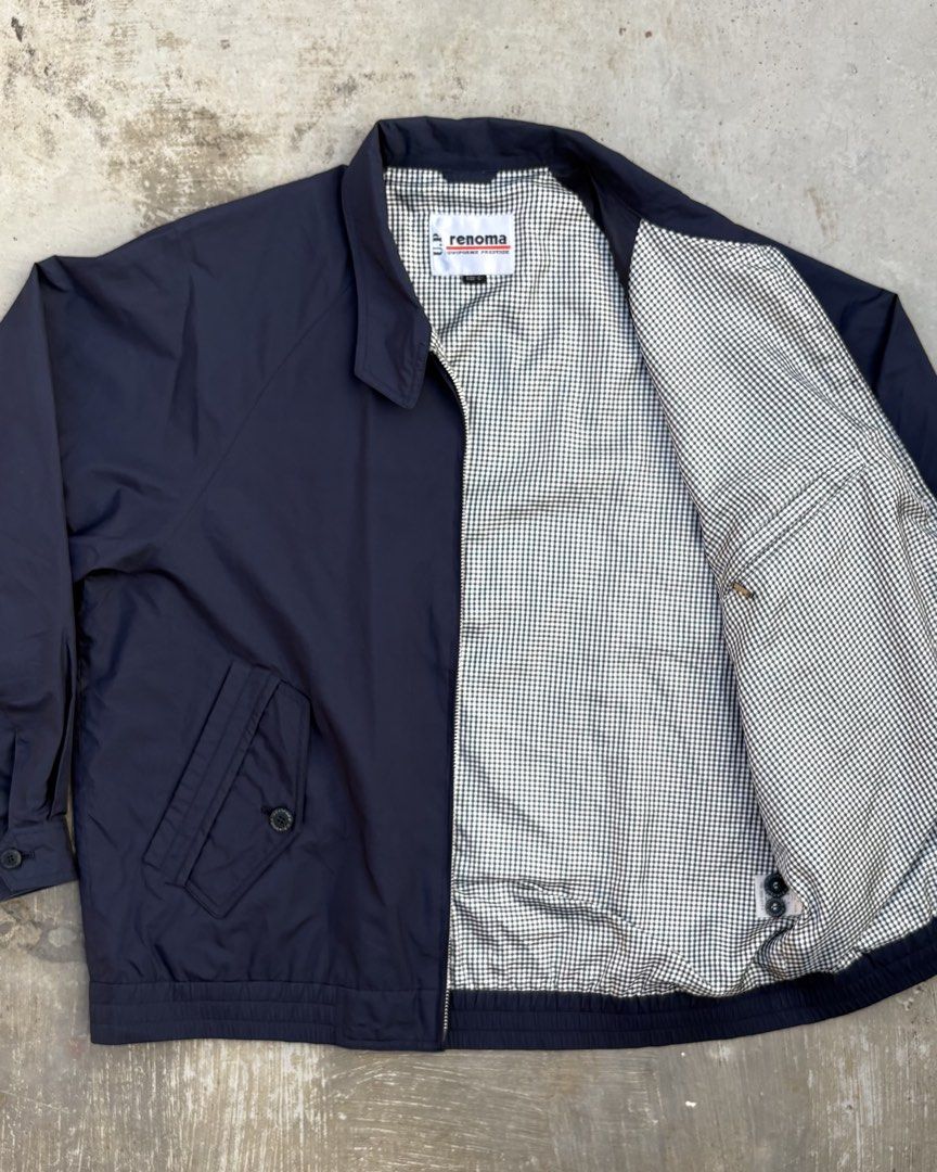 U.P Renoma Harrington Jacket (Category: Coats, Jackets and Outerwear) located in Calamba. Submitted by lyrons.wardrobe (Listing ID 1469255870, Image 2). Description: Dimes: 24⅜/25.5 • Brand/Line: U.P. Renoma (Uniforme Prestige) — a sub-line of the French fashion house Renoma, popular for casual and tailored outerwear. • Color: Navy blue with white and black gingham/checkered pattern lining. • Design Features: Full zip-up front, stand collar, embr