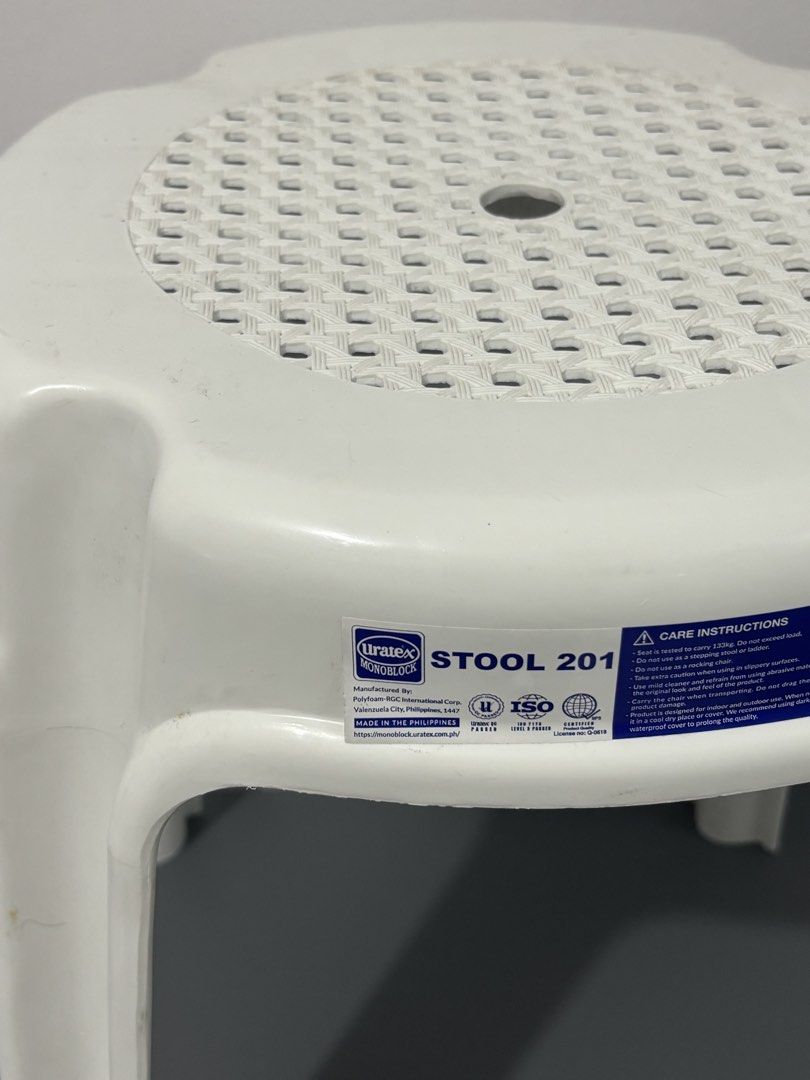 Uratex Monoblock Stool 201 White Plastic (Category: Chairs) located in Manila. Submitted by safefire.ae92b7 (Listing ID 1469356981, Image 2). Description: - Brand: Uratex Monoblock (Model: Stool 201) - Color: White - Weight capacity: Tested up to 133kg - Design: Woven textured top with a convenient center finger hole for lifting - Features: Original product label and care sticker still attached - Build: Sturdy 4-leg design, compact, and stackable