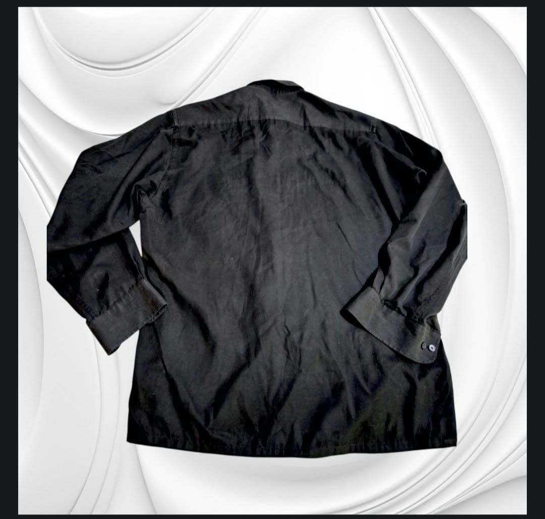 Van Heusen Black Long Sleeve Button-Down Shirt (Category: Formal Shirts) located in Paranaque City. Submitted by calm_youngstore7 (Listing ID 1469263750, Image 2). Description: LAST PIECE SALE! - Brand: Van Heusen - Color: Classic Black - Style: Long sleeve button-down shirt with traditional collar and button-down points - Details: Single left chest pocket and buttoned cuffs - Measurements: 25 inches across the chest, 29.5 inches in length - Cond