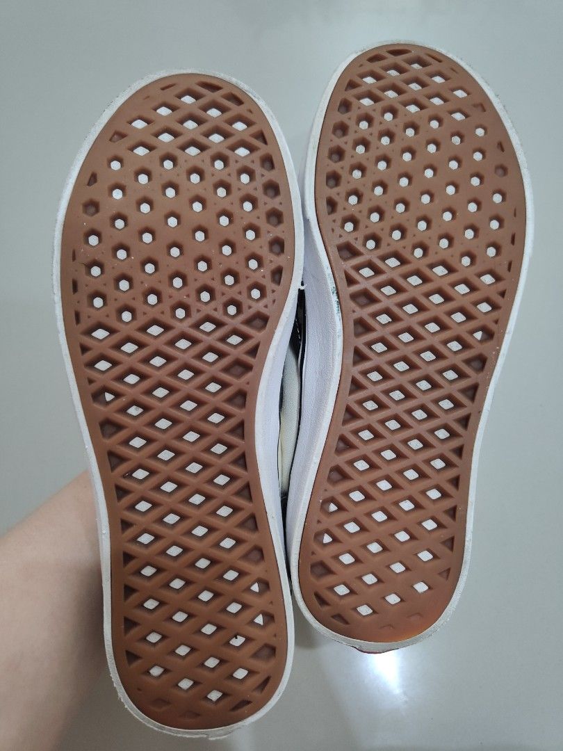 Vans ComfyCush Checkerboard Slip-On (Category: Sneakers) located in Calamba. Submitted by an_ne0501 (Listing ID 1469214096, Image 2). Description: - Brand/Model: Vans Checkerboard Slip-On Sneakers - Color: Classic Black and White - Comfort: Upgraded ComfyCush insoles for extra cushioning - Sole: Signature waffle outsoles with minimal tread wear - Condition: Canvas upper shows some fading and slight discoloration near the collar - Features: Easy s