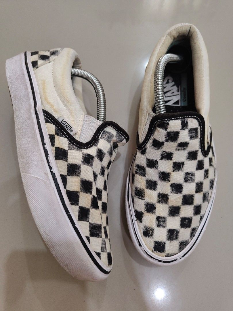 Vans ComfyCush Checkerboard Slip-On (Category: Sneakers) located in Calamba. Submitted by an_ne0501 (Listing ID 1469214096, Image 1). Description: - Brand/Model: Vans Checkerboard Slip-On Sneakers - Color: Classic Black and White - Comfort: Upgraded ComfyCush insoles for extra cushioning - Sole: Signature waffle outsoles with minimal tread wear - Condition: Canvas upper shows some fading and slight discoloration near the collar - Features: Easy s