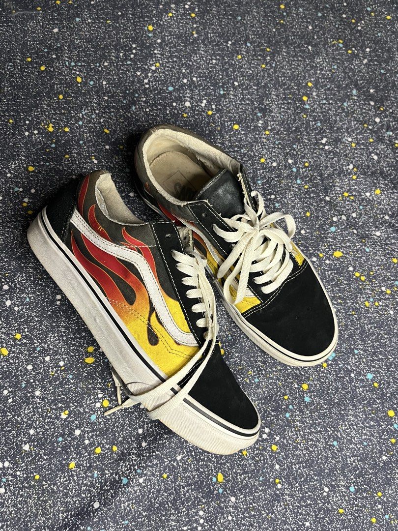 Vans Old Skool Flame Sneakers Size US 9.5 (Category: Sneakers) located in Manila. Submitted by lj_thrifter (Listing ID 1469316658, Image 3). Description: - Brand/Model: Vans Old Skool - Design: Iconic red, yellow, and orange flame graphic with black suede and canvas upper - Size: US Men's 9.5 / Women's 11 - Details: White side stripe, matching white laces, and classic vulcanized rubber waffle outsole - Condition: Mild scuffs on midsoles and light