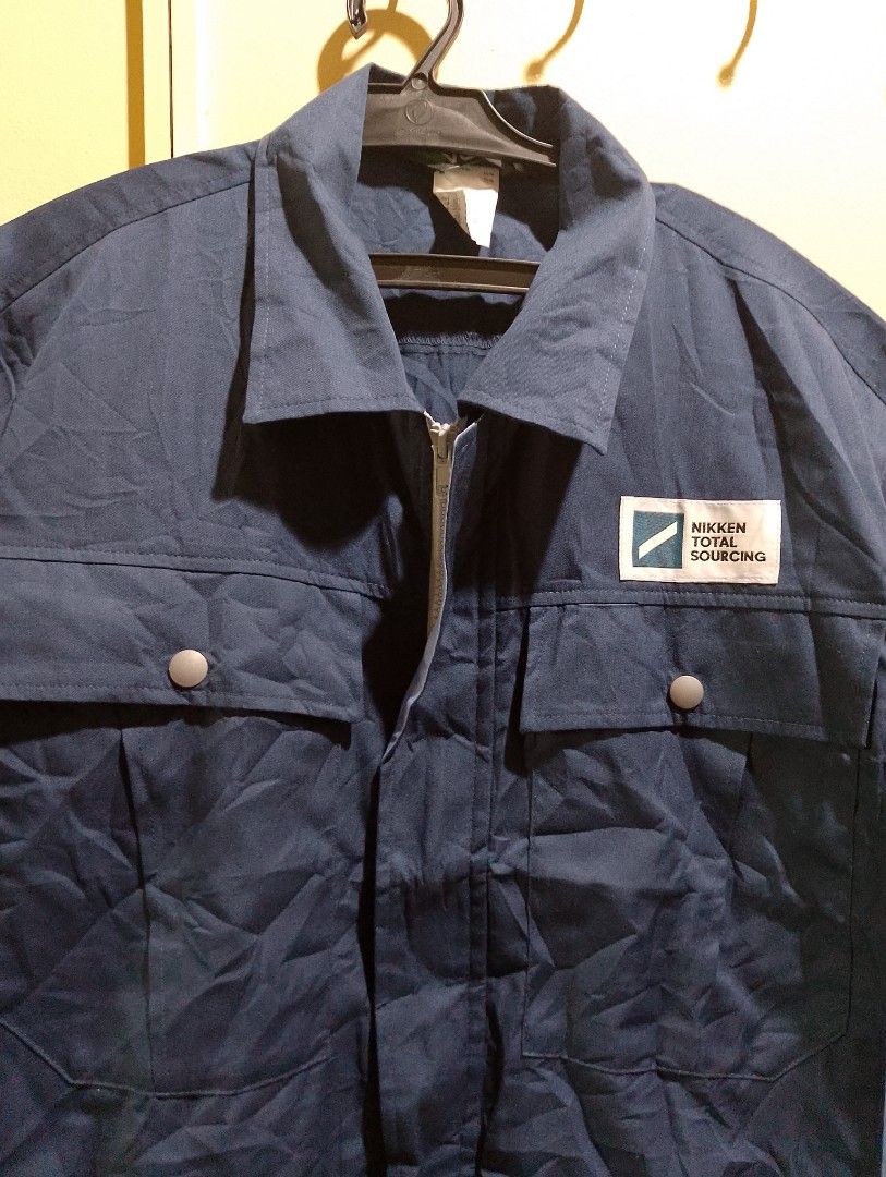 Verde Nikken Total Sourcing Blue Short Sleeve Work Jacket Size M (Category: Coats, Jackets and Outerwear) located in Buhi. Submitted by fpthrift1 (Listing ID 1469240458, Image 2). Description: - Brand: Verde - 24x21 - Color: Navy Blue - Size: Medium (M) - Details: Nikken Total Sourcing chest patch, full zip front, buttoned chest pockets, elastic hem - Condition: Clean, structured collar, great for work or casual layering.