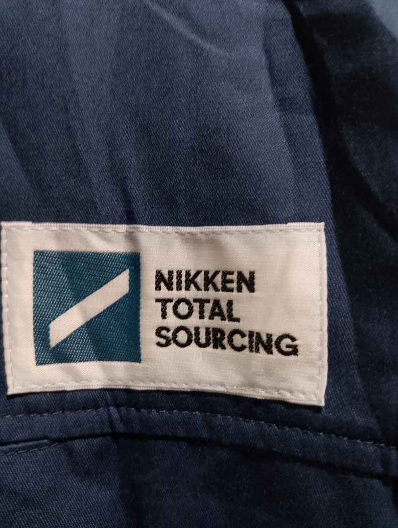 Verde Nikken Total Sourcing Blue Short Sleeve Work Jacket Size M (Category: Coats, Jackets and Outerwear) located in Buhi. Submitted by fpthrift1 (Listing ID 1469240458, Image 3). Description: - Brand: Verde - 24x21 - Color: Navy Blue - Size: Medium (M) - Details: Nikken Total Sourcing chest patch, full zip front, buttoned chest pockets, elastic hem - Condition: Clean, structured collar, great for work or casual layering.
