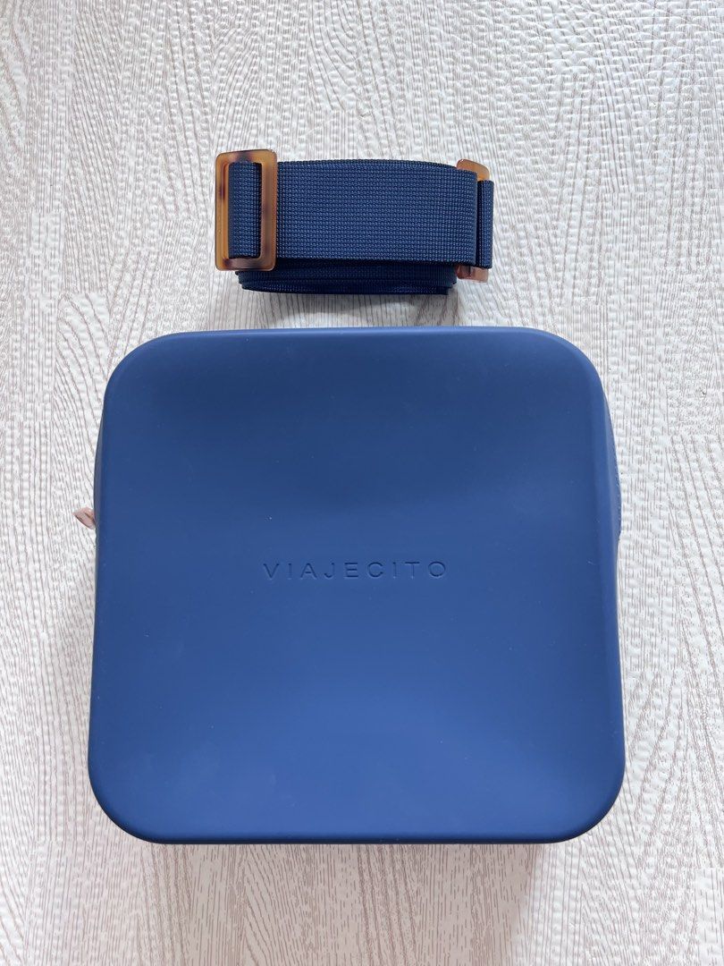 Viajecito XL Bag with Strap (Category: Cross-body Bags) located in Makati City. Submitted by nicole_7 (Listing ID 1469198881, Image 1). Description: - Viajecito - Model/Size: XL Bag with matching strap - Color: Dark Blue with nude/beige zippers and accents - Splash proof, water proof silicone material - Excellent condition, hardly used - Perfect for everyday bag and travel - Dimensions in inches: L 7.5 x W 3.1 x H: 7.