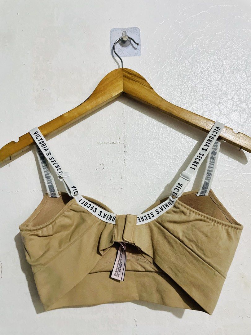 Victoria's Secret Beige Bralette (Category: Undergarments & Loungewear) located in Caloocan City. Submitted by lovemyclothes21 (Listing ID 1469264351, Image 2). Description: - Brand: Victoria's Secret - Color: Classic beige with white branded elastic straps - Size: S (fits B75, C70, D70, AA75, A75) - Closure: Back hook-and-eye - Style: Comfortable everyday bralette with soft, stretchy fabric - Condition: Clean and well-maintained.