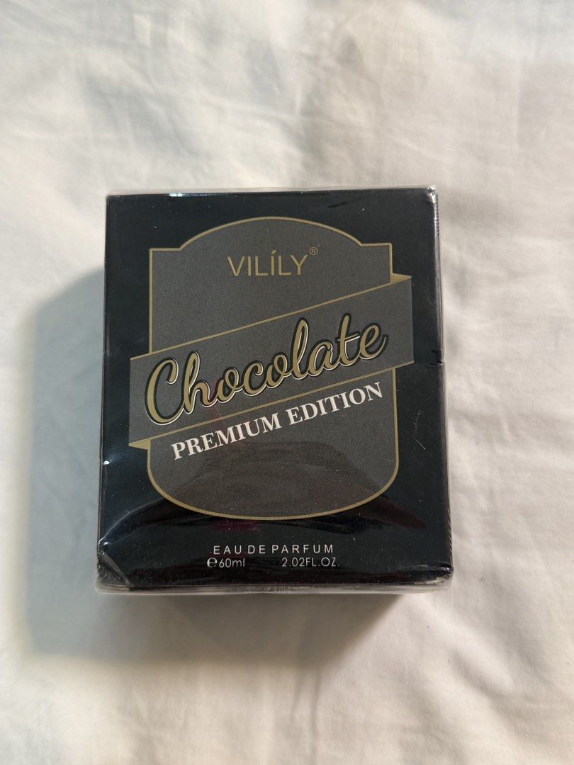Vilily Chocolate Premium Edition Eau De Parfum 60ml Sealed (Category: Fragrance & Deodorants) located in Manila. Submitted by iyacaruncho_ (Listing ID 1469306755, Image 2). Description: 🤎 VILILY Chocolate Premium Edition Perfume • Size: 60ml / 2.02 fl oz • Type: Eau de Parfum (EDP) • Condition: Extra PR product • Chocolate-themed fragrance • Elegant black and gold packaging • Great for personal use or gifting Original Price: ₱318 Selling Price: 
