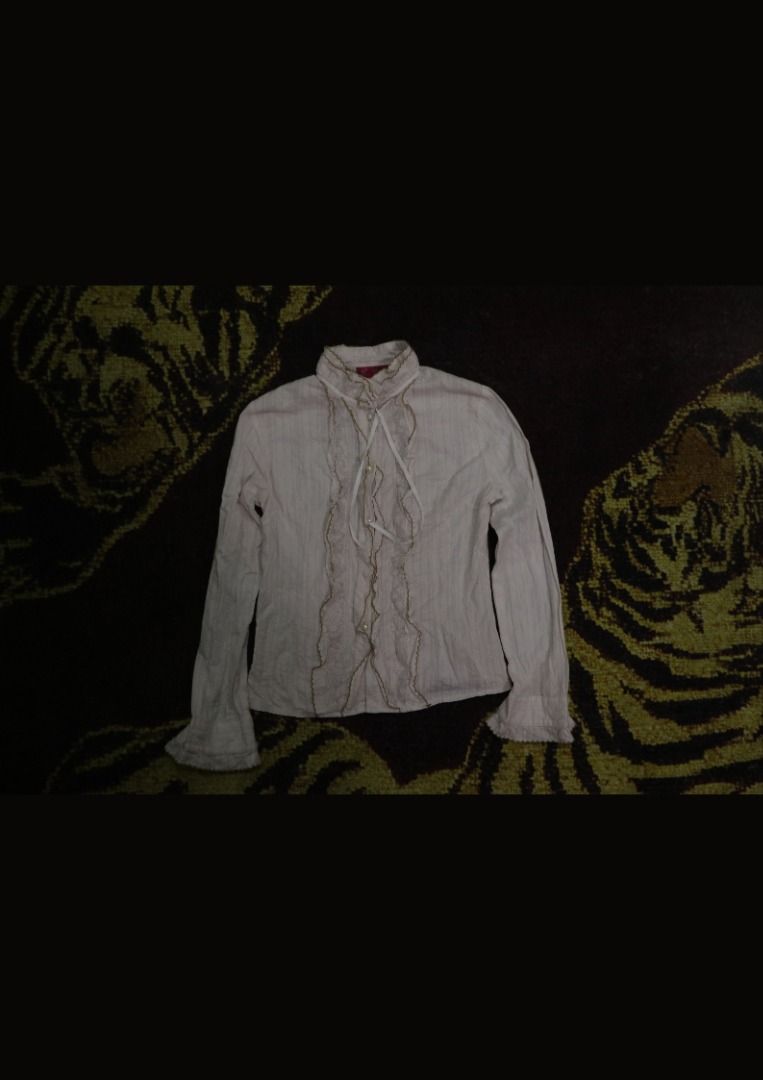 Vintage Blush Pink Ruffled Button-Up Blouse (Category: Longsleeves) located in Paranaque City. Submitted by skulkch (Listing ID 1469360241, Image 3). Description: Details: - Color: Blush pink / dusty pink - Style: Vintage, romantic, coquette - Long sleeves with buttoned cuffs - Front button closure with pearl-style buttons - Lace and ruffle detailing - Collared neckline- Fitted, feminine silhouette.