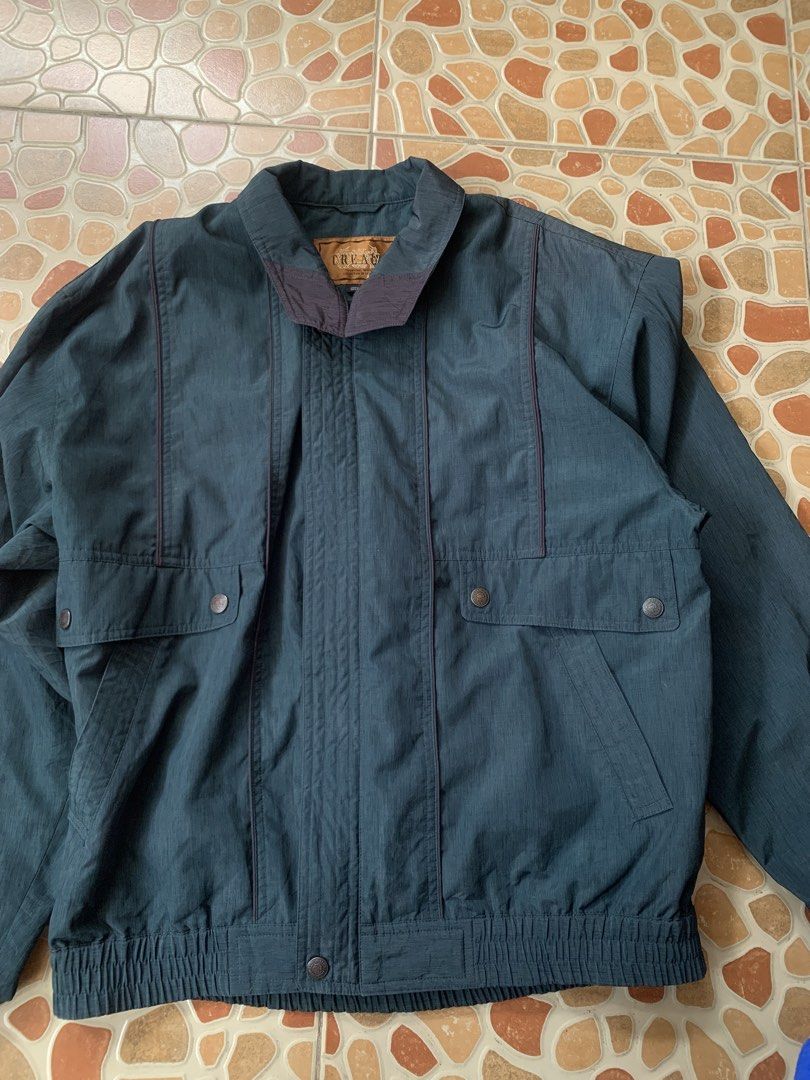 Vintage CREA Collection Dark Green Casual Jacket (Category: Coats, Jackets and Outerwear) located in Lipa City. Submitted by thriftshopp042 (Listing ID 1469201248, Image 2). Description: - Color: Dark green with contrast piping - Style: Vintage CREA collection, standard fit - Features: Collared neck, button closure, front pockets, ribbed hem - Material: Lightweight, ideal for cooler weather layering.