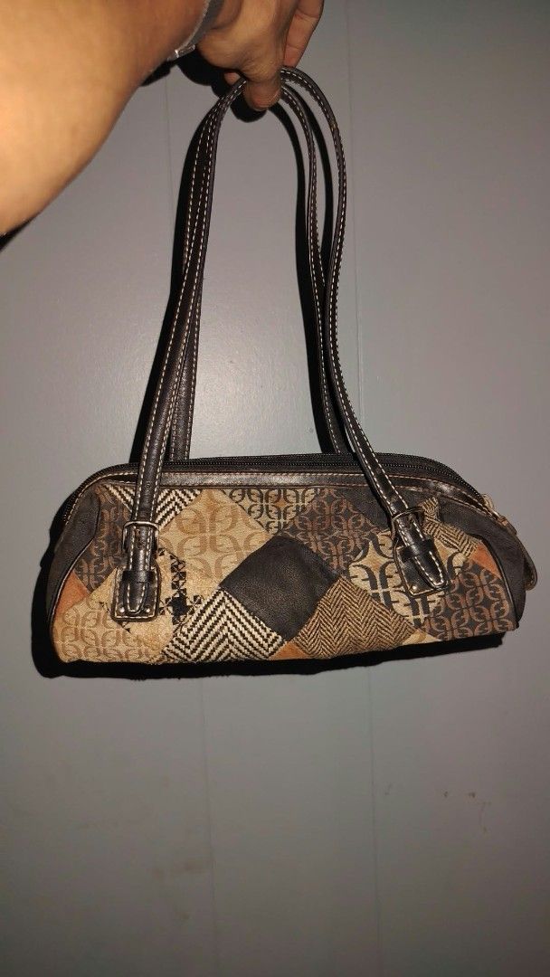 Vintage Fossil Patchwork Shoulder Bag Handbag (Category: Shoulder Bags) located in Manila. Submitted by chuaniki (Listing ID 1469328089, Image 1). Description: - Authentic vintage Fossil shoulder bag with classic Y2K style - Unique mixed patchwork design featuring houndstooth and monogram print - Premium dark leather accents and dual straps with buckle details - Secure zip-top closure for everyday use - Black fabric-lined interior complete with a