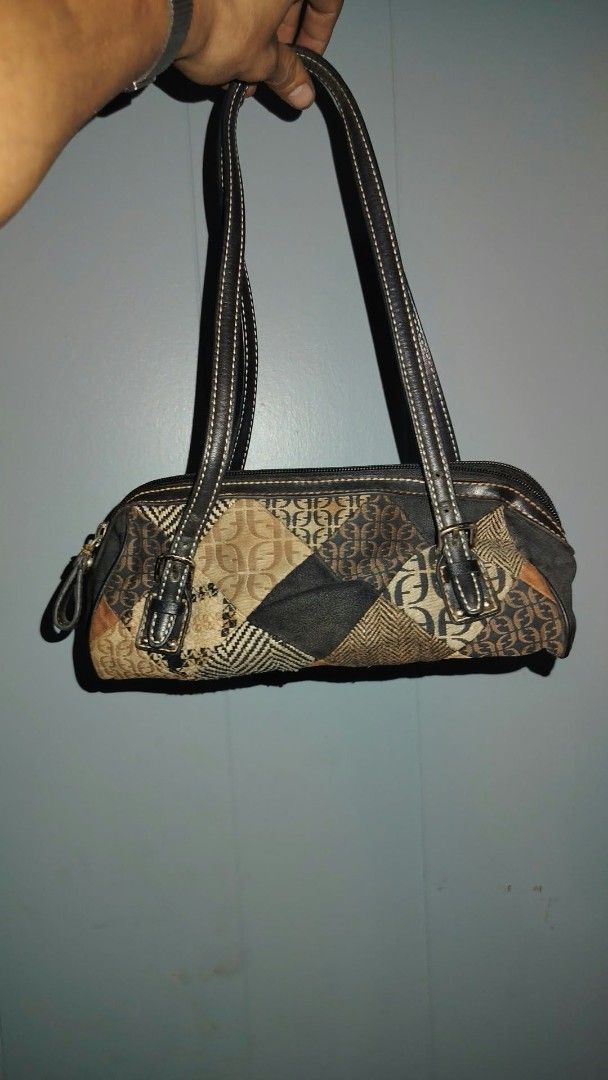 Vintage Fossil Patchwork Shoulder Bag Handbag (Category: Shoulder Bags) located in Manila. Submitted by chuaniki (Listing ID 1469328089, Image 3). Description: - Authentic vintage Fossil shoulder bag with classic Y2K style - Unique mixed patchwork design featuring houndstooth and monogram print - Premium dark leather accents and dual straps with buckle details - Secure zip-top closure for everyday use - Black fabric-lined interior complete with a