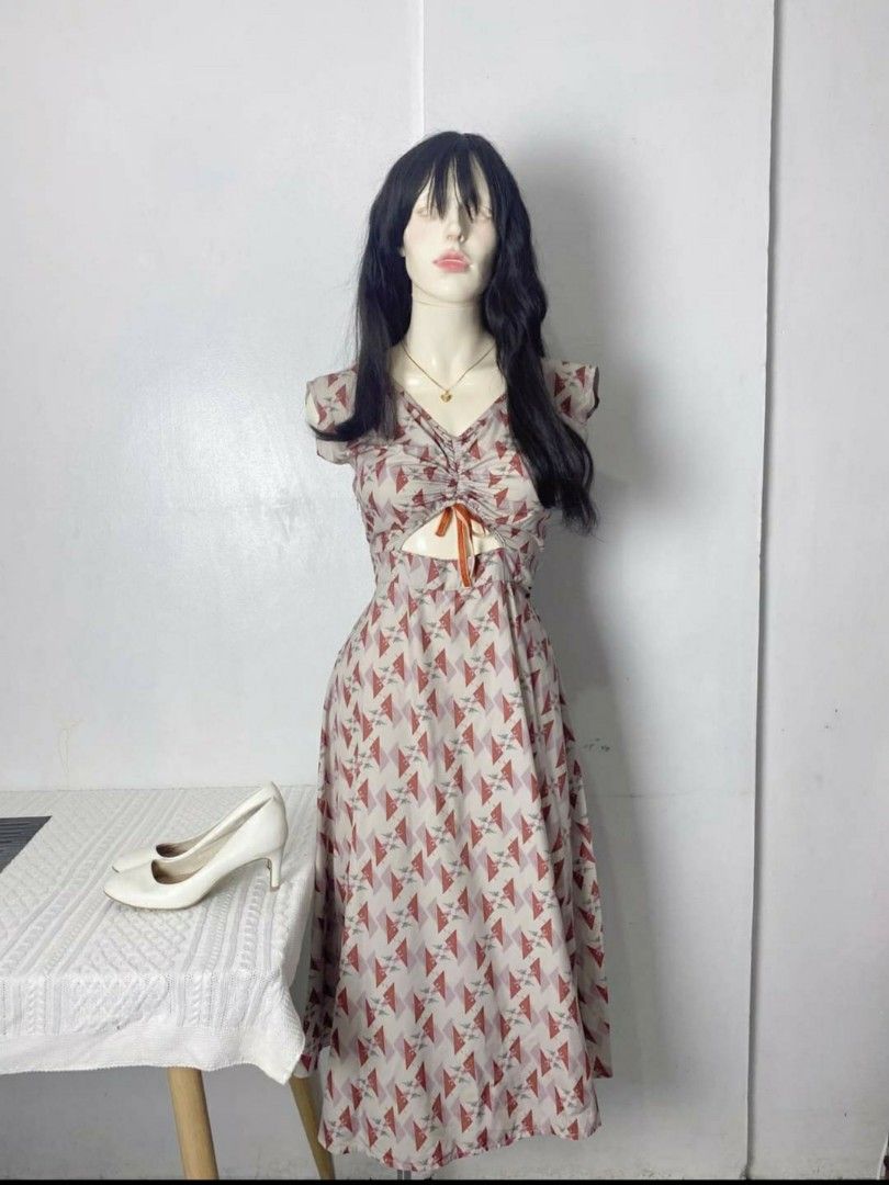 Vintage Geometric Pattern Midi Dress with Cutout Front (Category: Dresses) located in Manila. Submitted by viva4ever (Listing ID 1469322468, Image 1). Description: Small to semi medium - Style: Midi-length dress with a geometric triangle pattern - Details: Sweetheart neckline, short sleeves, front cutout with an orange ribbon tie accent, and a flared skirt - Condition: Worn once for a quick photo shoot, basically clean and like new - Size: Best f