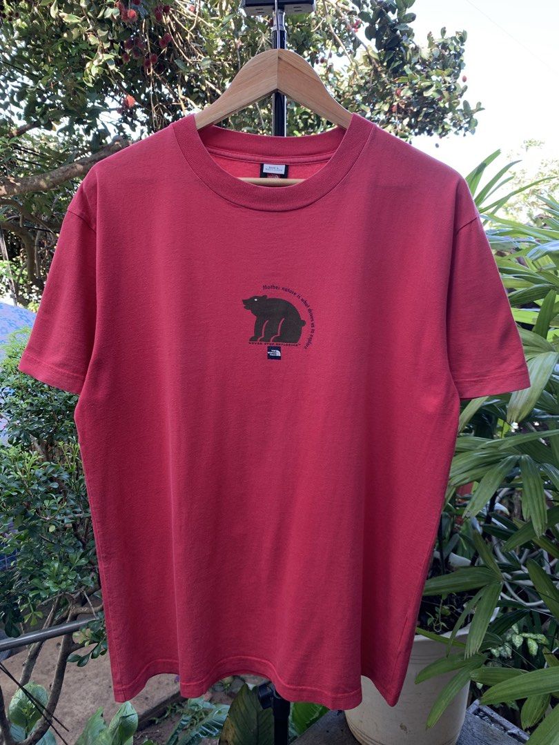 Vintage late 1990s/Y2K The North Face statement tee (Category: Tshirts & Polo Shirts ) located in Cagayan de Oro. Submitted by premium_thrifts (Listing ID 1469253134, Image 2). Description: Red colorway. Good condition. Double stitch on both sleeves and hem Fits Large L29" x W22" 20" (shoulder to shoulder) 8" (sleeve length) Issue: slight crackprint, and signs of fades Add shipping fee (via JRS or J&T).