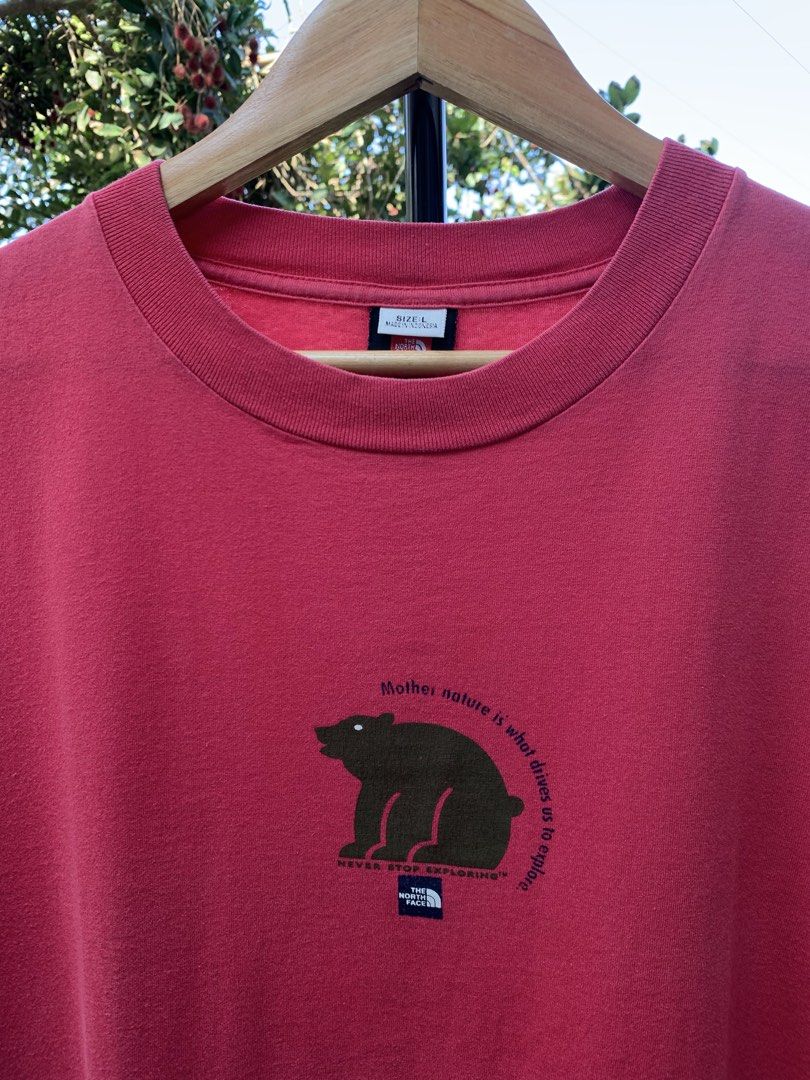 Vintage late 1990s/Y2K The North Face statement tee (Category: Tshirts & Polo Shirts ) located in Cagayan de Oro. Submitted by premium_thrifts (Listing ID 1469253134, Image 1). Description: Red colorway. Good condition. Double stitch on both sleeves and hem Fits Large L29" x W22" 20" (shoulder to shoulder) 8" (sleeve length) Issue: slight crackprint, and signs of fades Add shipping fee (via JRS or J&T).