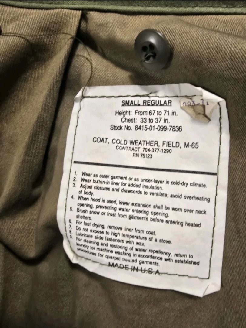 Vintage M65 US Military Field Jacket Small Regular (Category: Coats, Jackets and Outerwear) located in Manila. Submitted by alcollek (Listing ID 1469380412, Image 3). Description: - Color: Classic olive green - Material: Heavy-duty cotton blend fabric - Design: Stand collar with zipper detail and shoulder epaulets - Storage: Four front cargo pockets with secure flap closures - Fit: Adjustable drawstrings at the waist and hem for a customized fit 