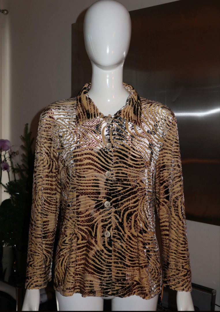 Vintage patterned button-down long sleeve shirt (Category: Longsleeves) located in Paranaque City. Submitted by skulkch (Listing ID 1469361734, Image 2). Description: - Style: Long sleeve button-down shirt with all-over abstract pattern - Colorway: Neutral brown and black tones - Fit: Relaxed fit with a collared neckline and front button closures - Fabric: Lightweight and comfortable - Versatility: Excellent layering piece for casual everyday out