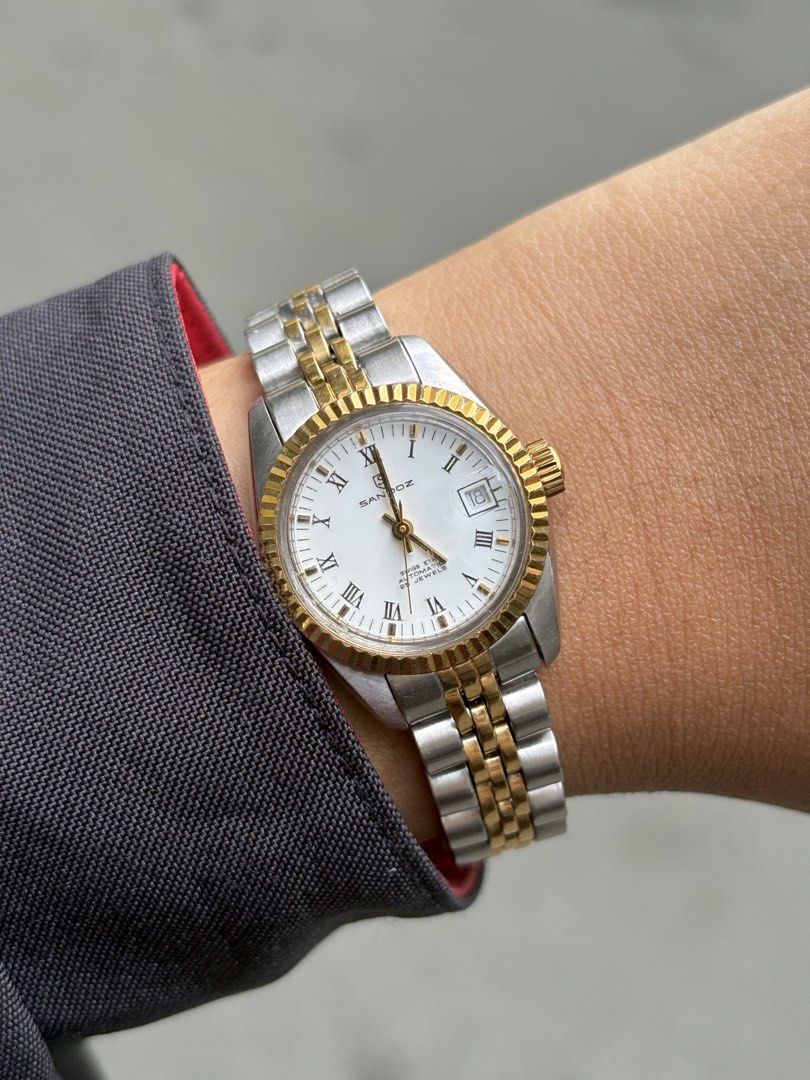 [Vintage] Sandoz Ladies Datejust Two-Tone Automatic (Category: Women's Watches) located in Bulacan. Submitted by whatsonyourwristmnl (Listing ID 1469193994, Image 1). Description: [VINTAGE] Sandoz Swiss Automatic Two-Tone Datejust Ladies Elegant vintage timepiece featuring a white Roman numeral dial, gold-tone fluted bezel, date display, and automatic movement with exhibition caseback. 🗓️ Birth Year: Exact year unconfirmed 📏 Case Size: Approx. 