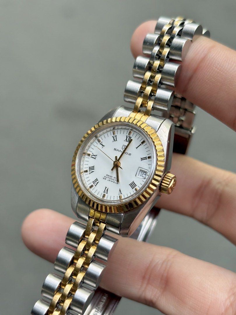 [Vintage] Sandoz Ladies Datejust Two-Tone Automatic (Category: Women's Watches) located in Bulacan. Submitted by whatsonyourwristmnl (Listing ID 1469193994, Image 3). Description: [VINTAGE] Sandoz Swiss Automatic Two-Tone Datejust Ladies Elegant vintage timepiece featuring a white Roman numeral dial, gold-tone fluted bezel, date display, and automatic movement with exhibition caseback. 🗓️ Birth Year: Exact year unconfirmed 📏 Case Size: Approx. 