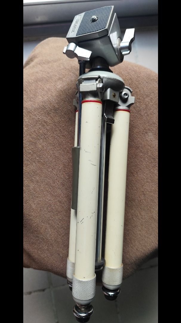 Vintage SLIK Camera Tripod (Category: Tripods & Monopods) located in Caloocan City. Submitted by purelion.ec38b3 (Listing ID 1469281557, Image 2). Description: - Vintage SLIK camera tripod, proudly Made in Japan - Classic metal build featuring stylish white leg sections - Integrated pan head handle for smooth adjustments - Fully functional knobs and mechanical adjustments - Standard mounting screw compatible with most cameras - Shows minor scuffs