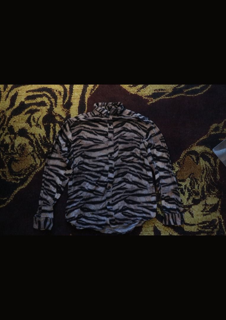 Vintage Tiger Print Button-Up Shirt (Category: Longsleeves) located in Paranaque City. Submitted by skulkch (Listing ID 1469361636, Image 3). Description: - Color: Taupe / brown, black, and beige - Pattern: Tiger stripe / animal print - Long sleeves with buttoned cuffs - Classic collared neckline - Full button-down front - Single chest pocket - Style: Vintage, grunge, Y2K, streetwear.