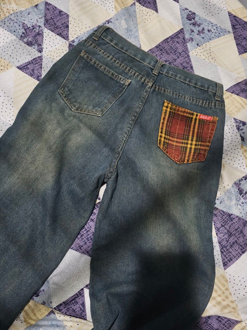 Vintage Wide Leg Jeans (Category: Jeans) located in Manila. Submitted by hojimissu (Listing ID 1469306576, Image 2). Description: - Color/Wash: Dark blue with vintage faded wash - Fit: Straight leg, versatile casual wear - Details: Unique red & yellow plaid back pocket with red Zhixi tag - Closure: Standard button and zipper fly with belt loops - Condition: Clean fabric, no noticeable flaws.