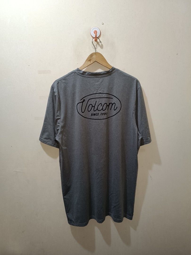 Volcom Shirt (Category: Tshirts & Polo Shirts ) located in Makati City. Submitted by ivsseyow03 (Listing ID 1469278963, Image 2). Description: Volcom grey t-shirt, short sleeves. Small logo on the chest, larger logo on the back. Crew neck collar. Tag reads XL/XLARGE. Made of 88% polyester and 12% elastane. Manufactured in China..