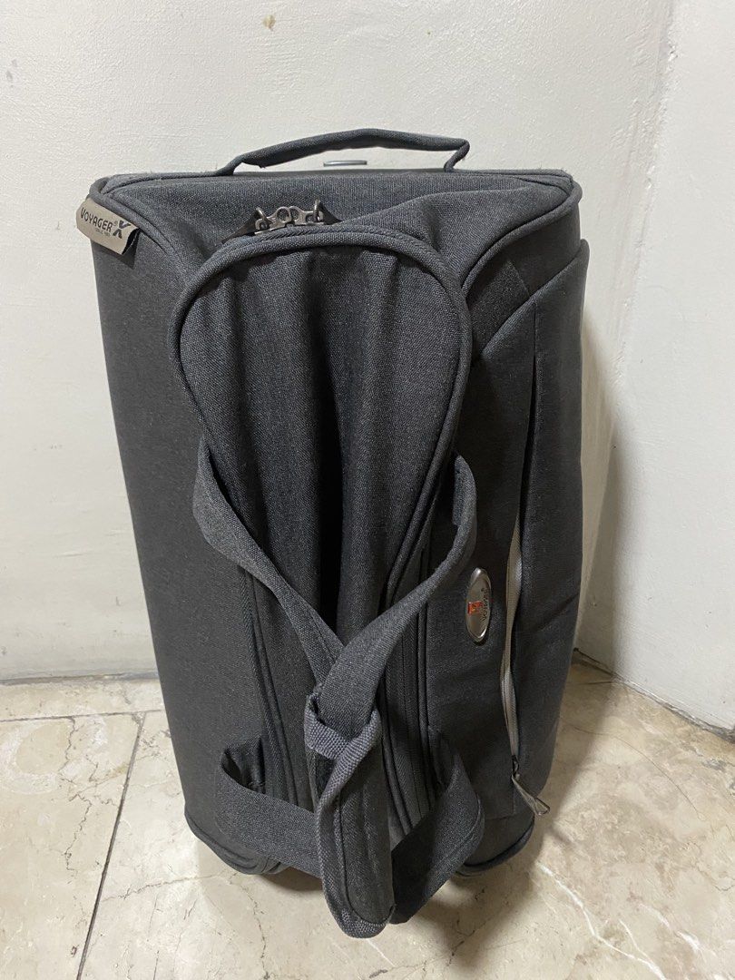 Voyager Rolling Travel Duffel Bag with Handle (Category: Luggage) located in Manila. Submitted by primomirp (Listing ID 1469244478, Image 1). Description: - Brand: Voyager - Color: Stylish dark grey canvas - Mobility: Pull-out top handle and robust wheels for easy towing - Comfort: Carry handles with a padded grip wrap - Storage: Front exterior zippered pocket with contrast zipper tape - Details: Voyager logo patch on the front and side - Conditi