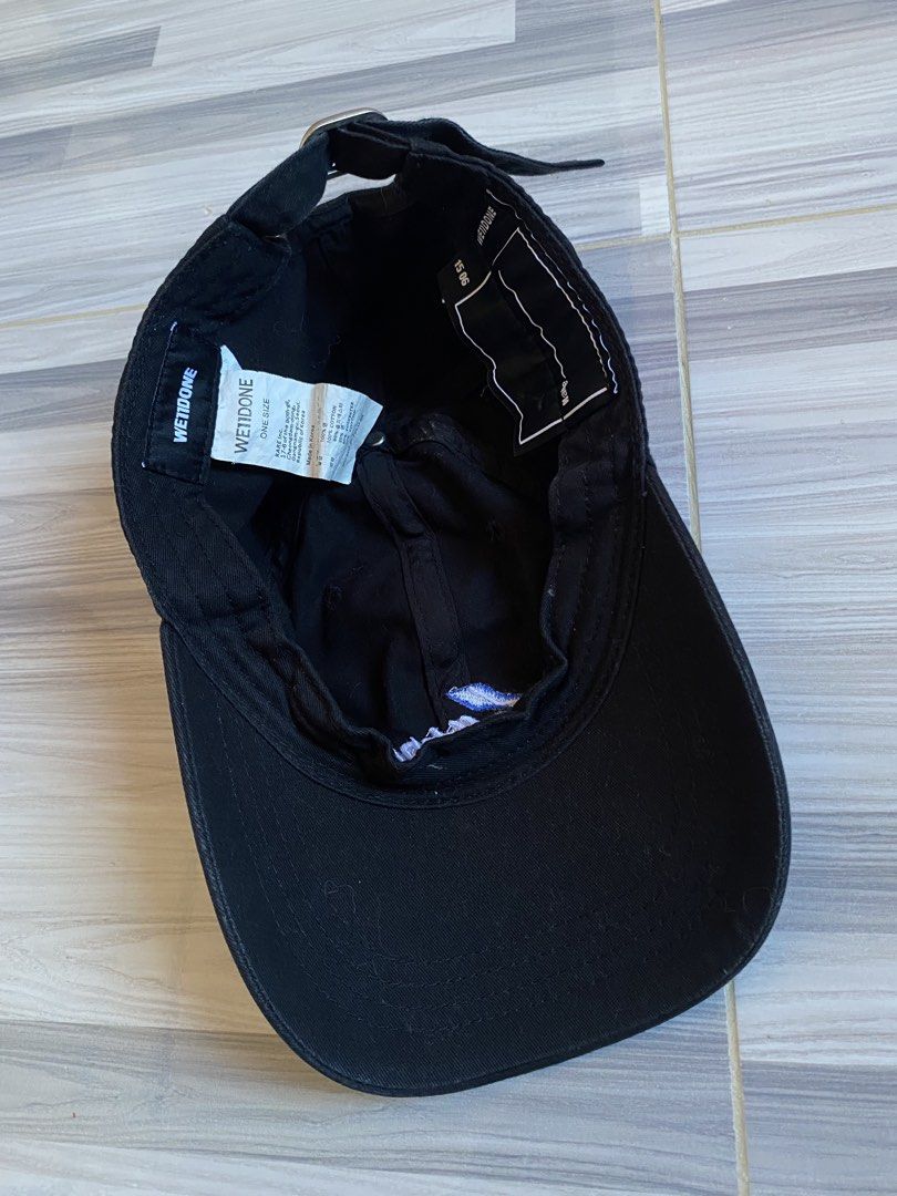 We11done Black Baseball Cap (Category: Caps & Hats) located in Bayambang. Submitted by vintagestuffph (Listing ID 1469198993, Image 3). Description: - Brand: We11done - Color: Black with blue embroidered logo - Material: 100% cotton (inside tags intact) - Size: One size fits all (adjustable metal strap with branded buckle) - Condition: Great everyday streetwear piece - Mode of Payment: GCash, BPI, or Bank Transfer - Shipping: Via J&T Express or S