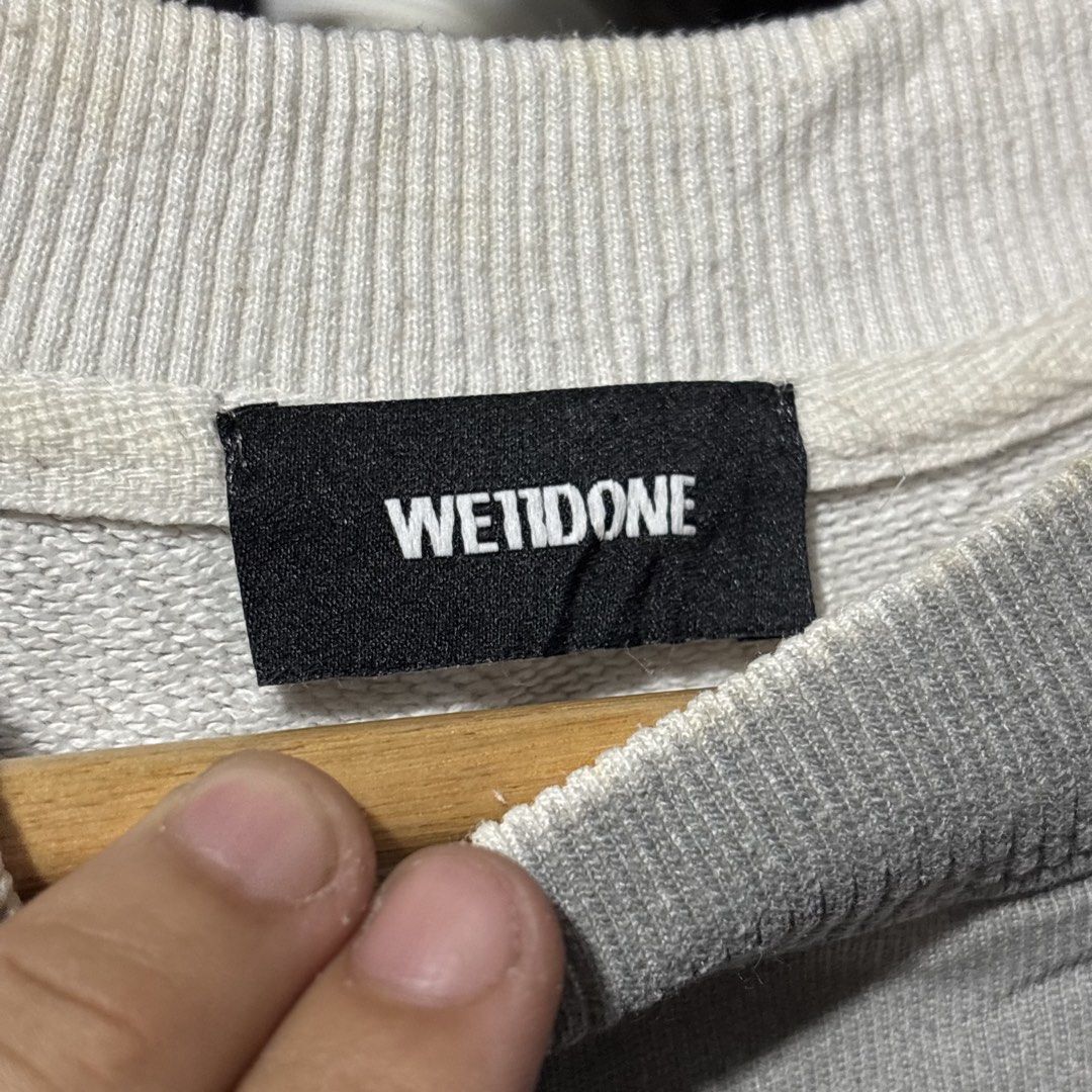 We11done Gray Sweatshirt (Category: Coats, Jackets and Outerwear) located in Caloocan City. Submitted by bonsatocha43876 (Listing ID 1469323116, Image 2). Description: - Authentic We11done gray sweatshirt - Bold stacked logo print on the front - Classic crew neck with ribbed cuffs and hem - Signature rubber name patch at the bottom back hem - Complete with brand neck tag and interior care labels - Measurements: 26 inches width x 26 inches length.