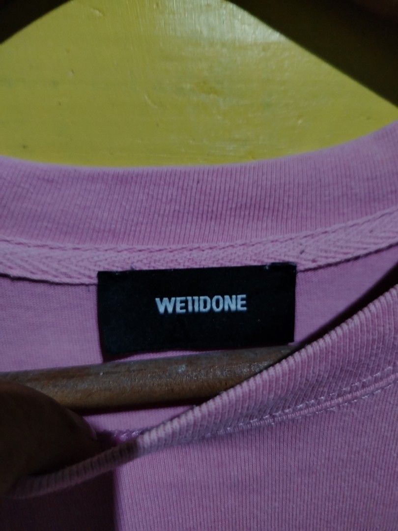 We11done Pink Bear Graphic T-Shirt (Category: Shirts) located in Caloocan City. Submitted by vincefresn21903 (Listing ID 1469285794, Image 3). Description: - Brand: We11done - Color: Pink with faded bear graphic (front & back) - Size: XS (Relaxed fit) XL best fit - Material: 100% Cotton - Details: Crew neck, short sleeves, signature black brand patch near lower back hem - Origin: Made in Korea - Condition: Excellent.