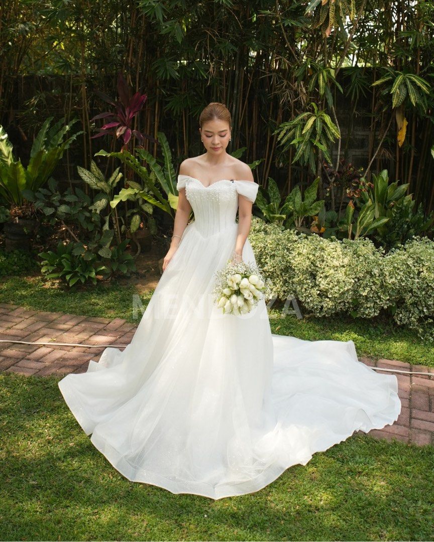 Wedding Gown with Pearl Details (Category: Evening dresses & gowns) located in Manila. Submitted by itsmaxxx28 (Listing ID 1469179761, Image 1). Description: Your “I Do” dress is already here, future Mrs. 👰💝 Selling my pre-loved wedding gown, worn once last April 24, 2026 bought from Belle & Bride Bridal Boutique. Gown details:✨ - Size: Fits SMALL to MEDIUM - Adjustable strap at the back - Padding included inside gown ✅Dry Cleaned ✅Worn Once ✅V