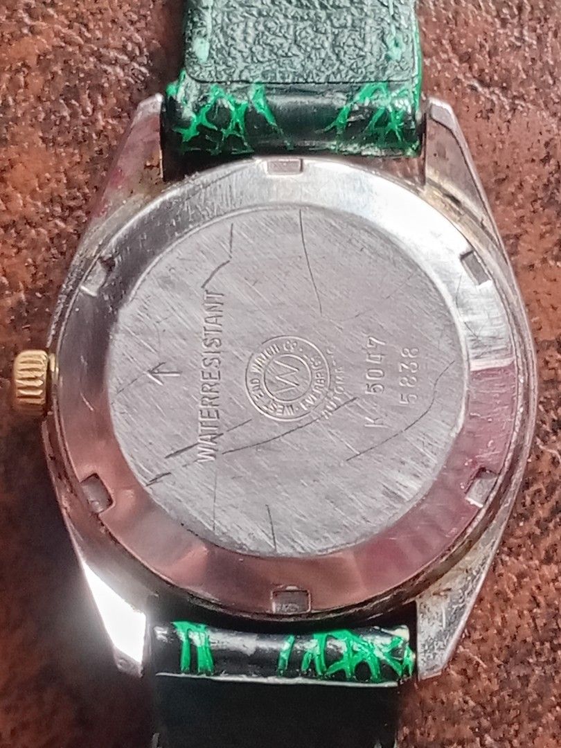 West End Watch Co Sowar Prima Automatic Watch (Category: Men's Watches) located in Bacoor. Submitted by happydolphin.239038 (Listing ID 1469181715, Image 2). Description: - Brand: West End Watch Co Sowar Prima - Movement: Swiss-made automatic, 25 jewels - Dial: Champagne with date window at 3 o'clock - Bezel & Crown: Gold-toned fluted bezel and signed logo crown - Case Back: Stamped with ref. numbers K 5047 and 5838 - Strap: Patterned green leath
