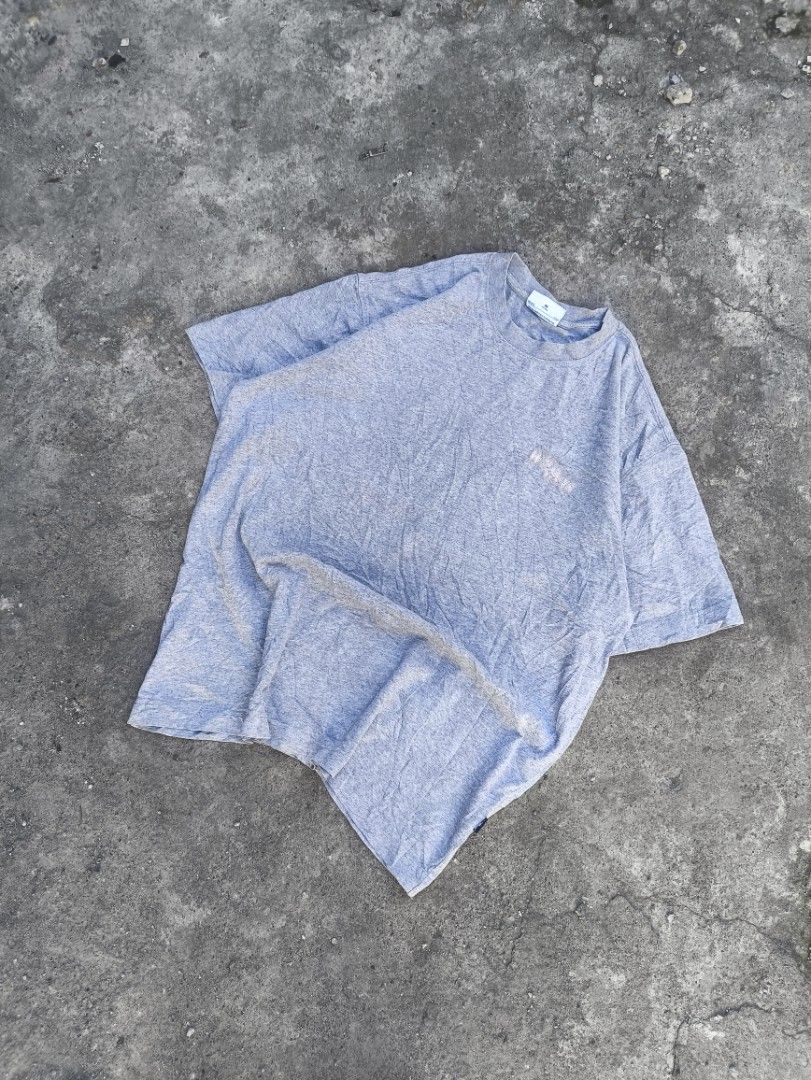 WH8SIS Grey Graphic Tee Size M (Category: Tshirts & Polo Shirts ) located in Manila. Submitted by maryaganda (Listing ID 1469222890, Image 2). Description: - Brand: WH8SIS - Size: M (170/88A) - Relaxed fit - Material: 100% Cotton, Made in China - Design: Large graphic print with pink & blue detailing on the back, plus a smaller print on the front chest - Special Feature: Funny care label reading 'You can wash it any fucking way'.