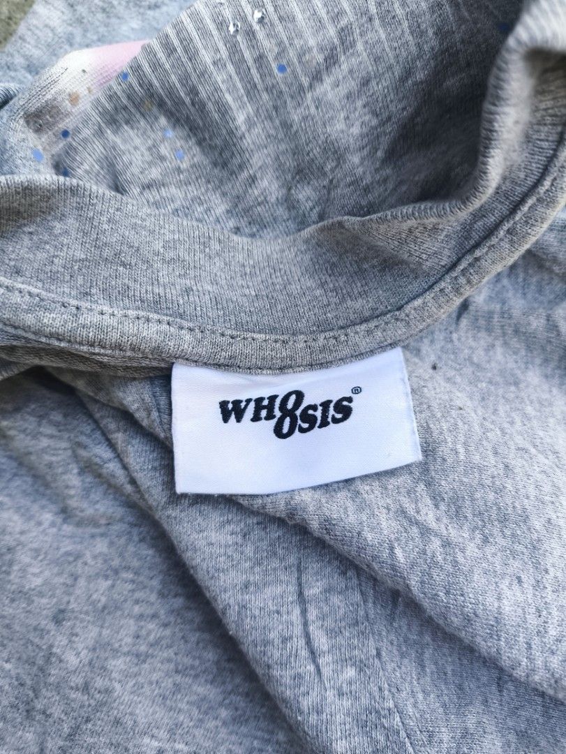 WH8SIS Grey Graphic Tee Size M (Category: Tshirts & Polo Shirts ) located in Manila. Submitted by maryaganda (Listing ID 1469222890, Image 3). Description: - Brand: WH8SIS - Size: M (170/88A) - Relaxed fit - Material: 100% Cotton, Made in China - Design: Large graphic print with pink & blue detailing on the back, plus a smaller print on the front chest - Special Feature: Funny care label reading 'You can wash it any fucking way'.