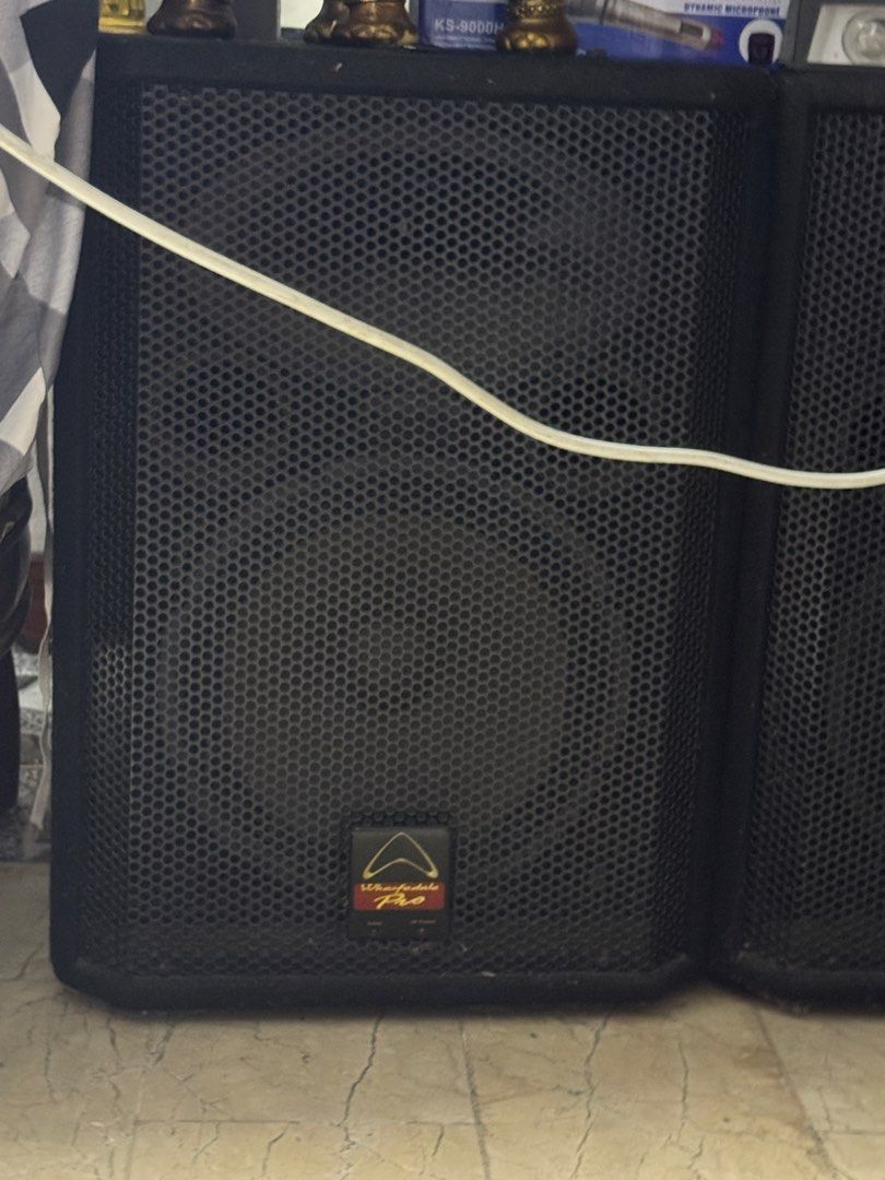Wharfedale Pro Audio Speaker Cabinet (Category: Soundbars, Speakers & Amplifiers) located in Quezon City. Submitted by chi__028 (Listing ID 1469332073, Image 2). Description: 2 Speakers - Brand/Model: Wharfedale Pro speaker box - Build: Heavy-duty cabinet design with black metal mesh grille - Condition: Solid build with clear logo badge - Application: Ideal for stage or studio monitoring - Performance: Delivers solid, clear sound performance.